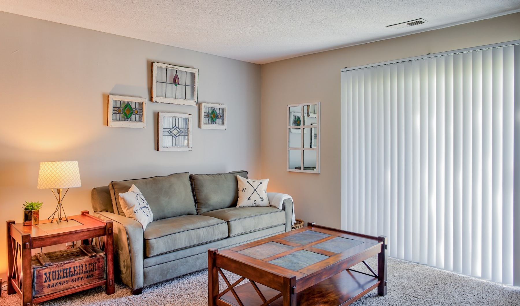 Upgraded Nora Far Northside apartments Styled living room with blinds