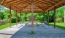 Pergola outside with picnic tables